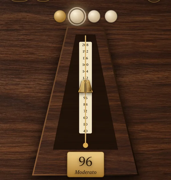 Heritage skin metronome: a walnut pyramid with a brass pendulum